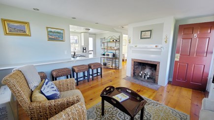 Truro Cape Cod vacation rental - Living room with kitchen with counter seating beyond