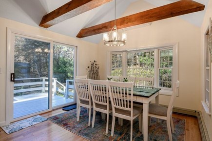 Eastham Cape Cod vacation rental - Dining area overlooking the deck and backyard
