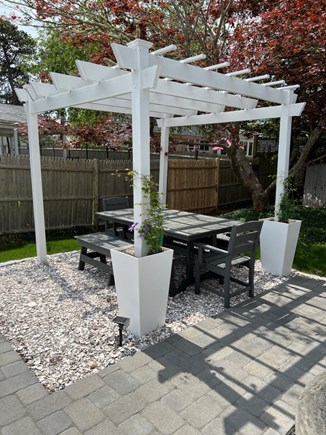 West Dennis Cape Cod vacation rental - Backyard dining and patio.