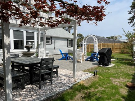 West Dennis Cape Cod vacation rental - Outdoor shower and fire table.