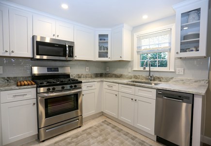 West Dennis Cape Cod vacation rental - New quartzite counters and clear glass backsplash