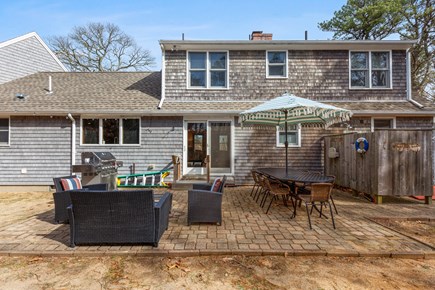 Eastham Cape Cod vacation rental - Private backyard with seating, dining table and private shower