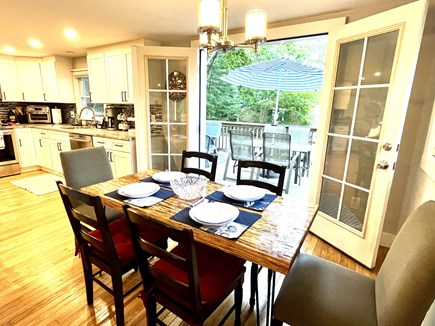 East Falmouth Cape Cod vacation rental - Dining area opening to the deck dining and lounge space