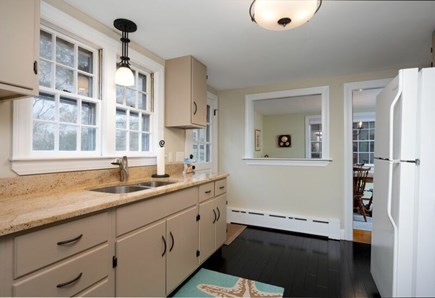 Centerville Cape Cod vacation rental - Kitchen with door onto back deck and facing the dining room