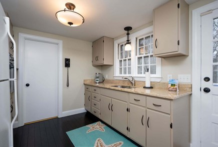 Centerville Cape Cod vacation rental - A refurbished blast from the past, this kitchen demonstrates the lasting power of vintage 
products (wall phone!)