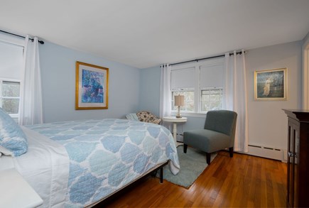 Centerville Cape Cod vacation rental - Primary bedroom with Queen sized bed, seating area and en suite bathroom