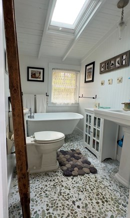 North Eastham Cape Cod vacation rental - Stone floored bathroom with antique ball and claw tub.