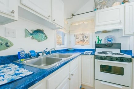 Sagamore Beach Cape Cod vacation rental - Kitchen with white appliances and aqua blue countertops