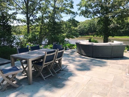 Centerville Cape Cod vacation rental - Outdoor dining on the patio overlooking the water
