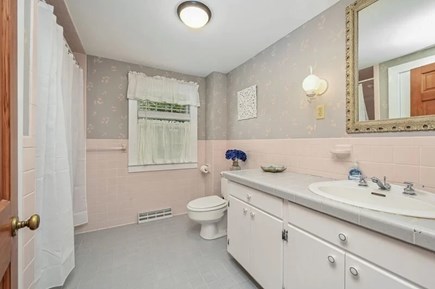 North Chatham Cape Cod vacation rental - Main floor bathroom #1 with tub shower combo