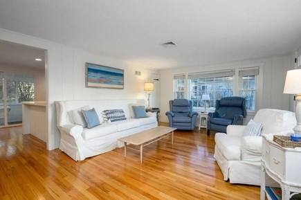 West Harwich Cape Cod vacation rental - Warm wood tones and sunlit seating through the living area