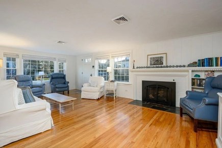 West Harwich Cape Cod vacation rental - Living space with warm wood and sunlit seating