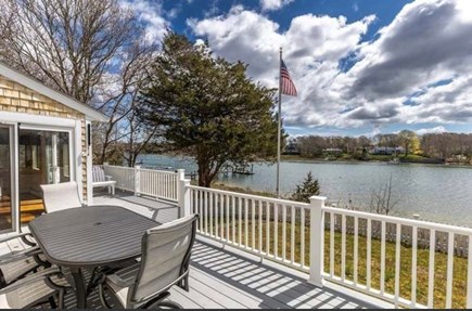 East Falmouth Cape Cod vacation rental - Deck overlooking water includes large patio dining table