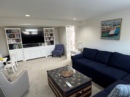 Dennis Village Cape Cod vacation rental - Family room with wrap around couch and 65 inch Smart TV