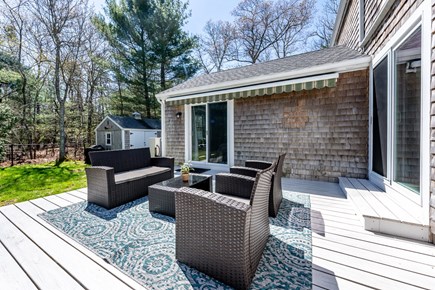 Sandwich Cape Cod vacation rental - Back patio, incl outdoor shower and fire pit.