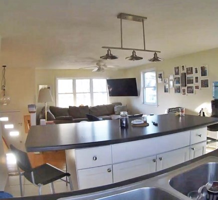 Falmouth, Teaticket Cape Cod vacation rental - Kitchen/Living Area With Sectional & Flatscreen TV