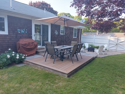 Yarmouth, Halfway Pond Cape Cod vacation rental - Mature fenced yard with dining for six, new grill & fire pit.
