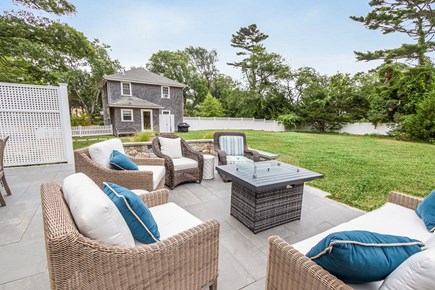 Osterville Cape Cod vacation rental - Back patio off cabana, outdoor fireplace