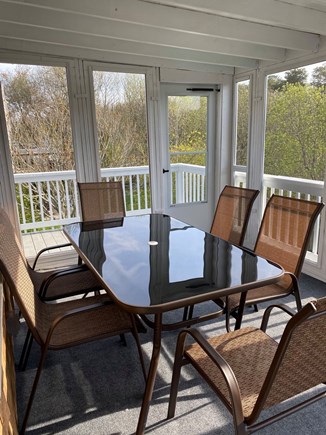 Yarmouth Cape Cod vacation rental - Screened in porch with outdoor dining area