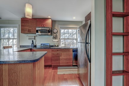 Provincetown, MA Cape Cod vacation rental - Access to loft off the nicely lit kitchen overlooking garden