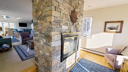 Eastham Cape Cod vacation rental - Stone double-sided gas fireplace in sunroom and sitting area