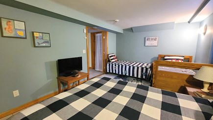 Eastham Cape Cod vacation rental - Lower level bedroom with one queen bed and two twin beds