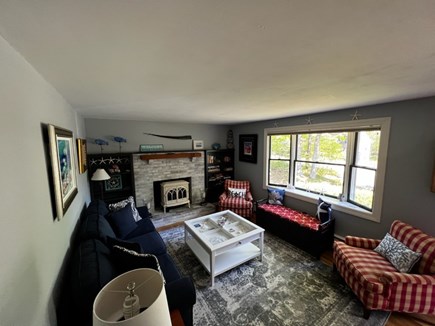 Brewster Cape Cod vacation rental - Cozy living room with a bay window and gas fireplace.