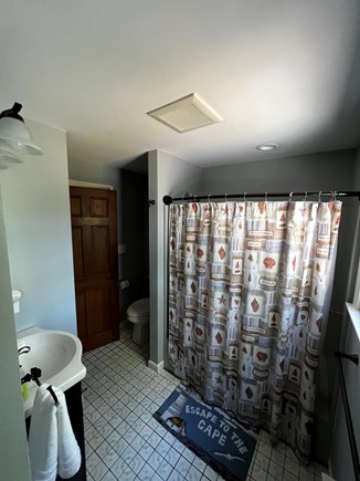 Brewster Cape Cod vacation rental - Bathroom down stairs with tub/shower.
