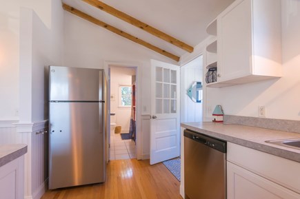 Sandwich Cape Cod vacation rental - Kitchen leading into the bathroom and the back entrance.