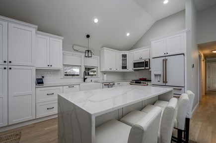 Hyannis Cape Cod vacation rental - Kitchen large island and seating for four guests.