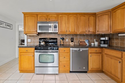 Yarmouth Cape Cod vacation rental - Kitchen with walkway into the living room