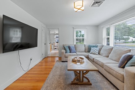 Yarmouth Cape Cod vacation rental - 65 inch smart TV with a bay window for natural light.