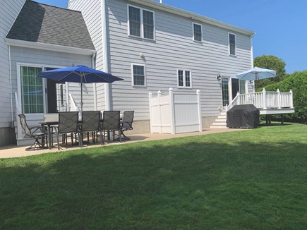 South Yarmouth Cape Cod vacation rental - Large backyard with outdoor seating, deck, and outdoor shower.