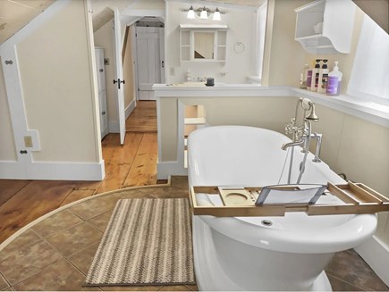 Orleans Cape Cod vacation rental - Soaking tub, full mirror and bathroom area fill this large room