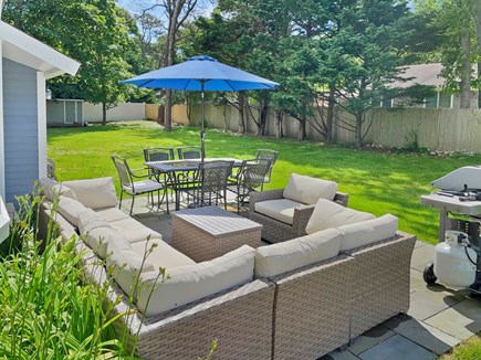 Hyannis Cape Cod vacation rental - Backyard, outdoor furniture, dining, grill, 100% fenced in.