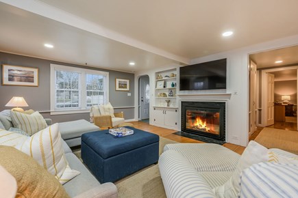 Hyannis Cape Cod vacation rental - Living room with plenty of seating, fireplace and TV.