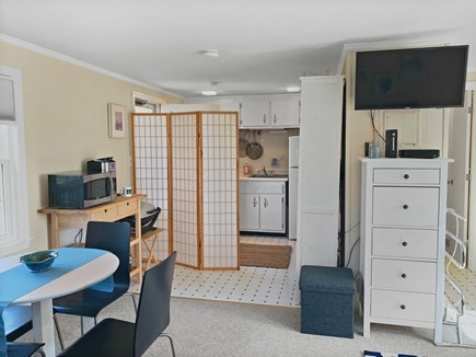 Dennis Port Cape Cod vacation rental - Dining area, kitchen area with privacy screen.