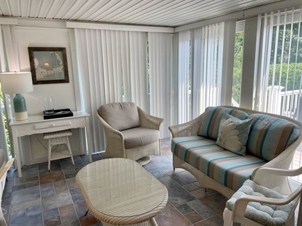 Harwich Cape Cod vacation rental - Sunroom with seating.