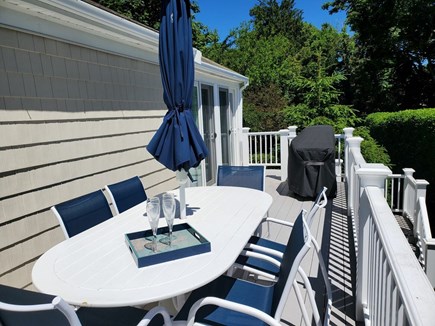 Harwich Cape Cod vacation rental - Back deck with seating and grill.