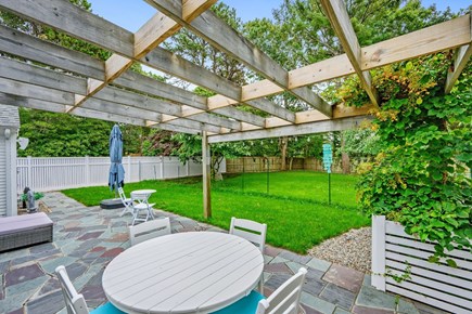East Sandwich Cape Cod vacation rental - Main side patio with dining and seating area