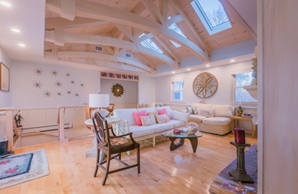East Sandwich Cape Cod vacation rental - Living room with access to the downstairs and a remote work area.
