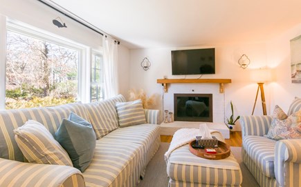 Sandwich Cape Cod vacation rental - Living room with fireplace and TV.