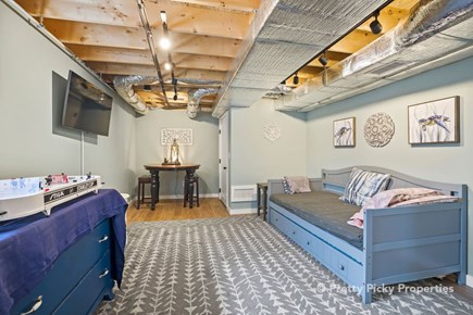 Wellfleet Cape Cod vacation rental - Lower level has a TV and foosball.Trundle twin beds here as well