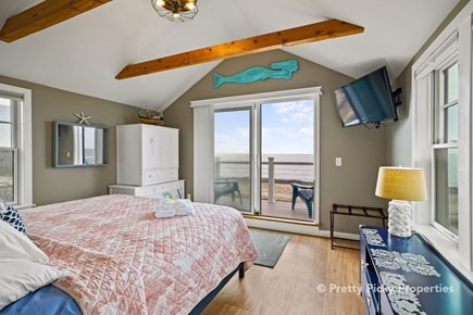 Wellfleet Cape Cod vacation rental - King master bedroom, second level with balcony and bay view.