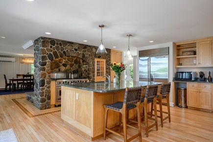 Centerville Cape Cod vacation rental - Custom kitchen with island and dining room.