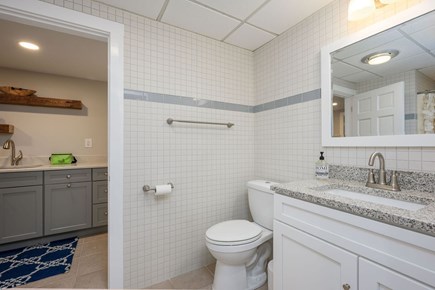 Centerville Cape Cod vacation rental - Jack and Jill Bathroom #4 with shower opens to lower level kitchen and sitting area with extra sleep sofa