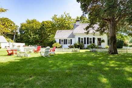 Brewster Cape Cod vacation rental - Plush, green front yard. Enjoy a beverage on an Adirondack chair
