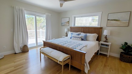 Truro Cape Cod vacation rental - Second floor primary bedroom with king bed and slider to deck