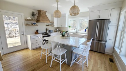 Truro Cape Cod vacation rental - Nicely-equipped kitchen with center island with counter seating