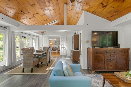 West Hyannisport Cape Cod vacation rental - Enormous great room featuring dining table, TV and a work space